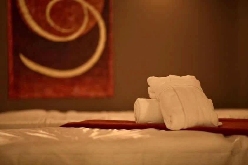 Le Palais Art Hotel Praha Bagian luar foto A folded towel on a bed
